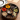 Traditional Indian spice box with turmeric, cumin, coriander and other medicinal spices.