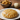 Soft and golden Maharashtrian Puran Poli with a bowl of sweet chana dal stuffing.
