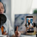 Indian digital creator recording educational video on smartphone