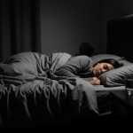 person sleeping peacefully in a dark