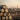 stack of oil barrels in the foreground with an oil mining site