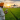 young farmer using a smartphone drone on Indian farmland
