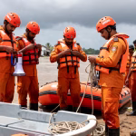 Odisha disaster response teams preparing with boats and rescue equipment