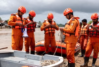 Odisha disaster response teams preparing with boats and rescue equipment