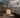 Smart aroma diffuser releasing mist in a calm bedroom setting