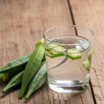 clear okra water with a few slices of okra