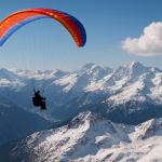 paraglider soaring over the snow-capped Alps