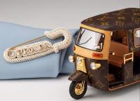 Prada’s crochet safety pin brooch and Louis Vuitton auto-rickshaw styled bag