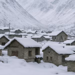 Snow covered houses and mountains in Drass village