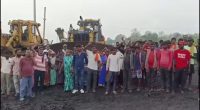 Threat to Livelihood: Unorganized workers at Muraidih Colliery vent their anger; halt operations by blocking traffic.