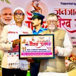 governor-santosh-gangwar-honors-khortha-lyricist-vinay-tiwari